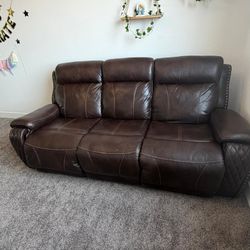 Gia Power Reclining Sofa with Drop Down Table and Adjustable Headrest from Cambridge Home.