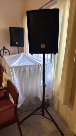 Speakers mounted on stands
