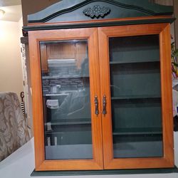 Wall mounted wooden cabinet.