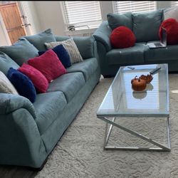 Teal couch and loveseat