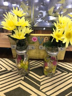 Milk bottles attached to wood