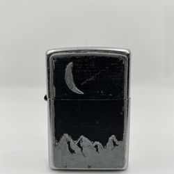 2000 ZIPPO BRADFORD PA CRESCENT MOON AND MOUNTAINS LIGHTER