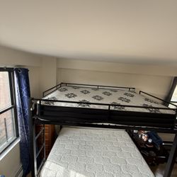 double-sized bunk bed, with mattresses