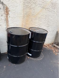 $20 EACH 55 GALLON DRUMS BLACK IN COLOR. IN GREAT CONDITION