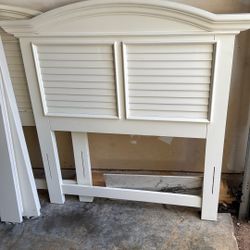 Two cream twin bed with rails and slats