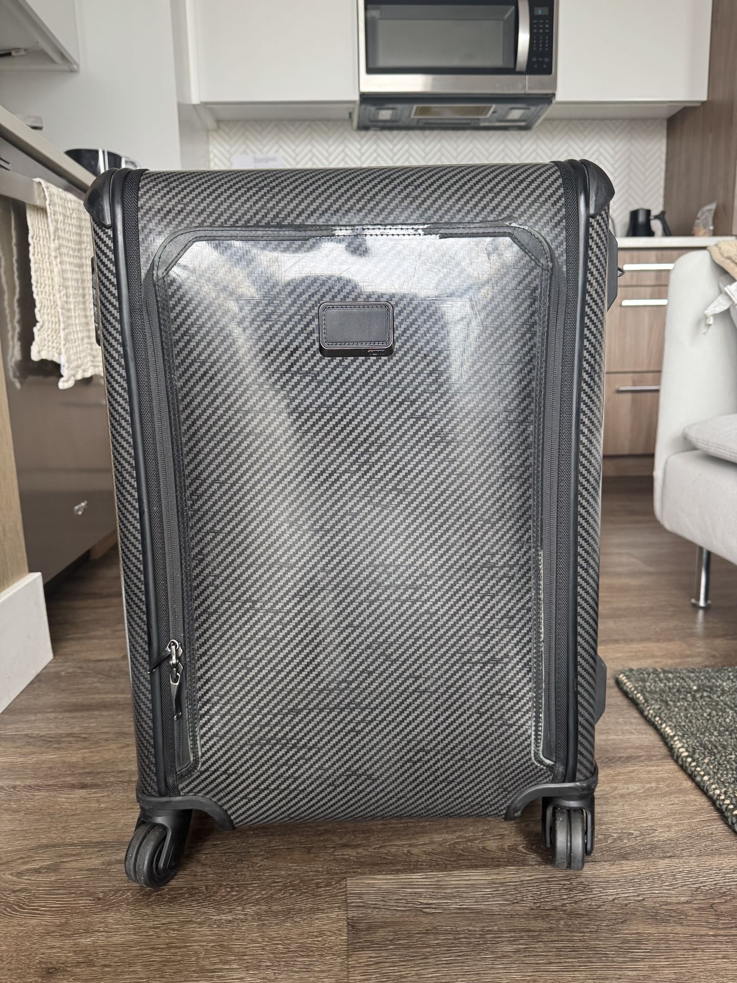 Tumi International Front Pocket Expandable Four Wheel Carry On Suitcase