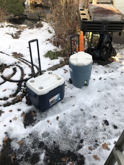 Two Large Coolers On Wheels With Pull Up Handles