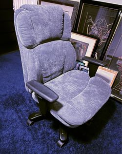 Blue gray ergonomic padded office chair with adjustable height on wheels