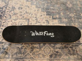 White Fang checkered skateboard
