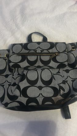 Grey coach backpack with black “C” letters