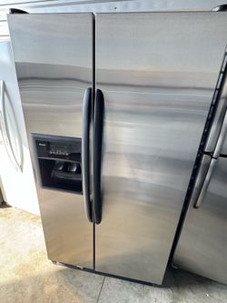 Kenmore Refrigerator  side by side stainless steel with water and ice maker  dimensions 68 7/8 height 35 7/8 width 32 depth works great no issues at a