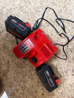 Two Milwaukee batteries, and a rapid charger