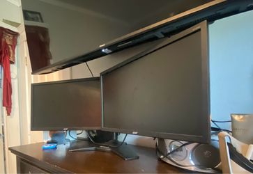 Acer dual monitors held up by planar holder