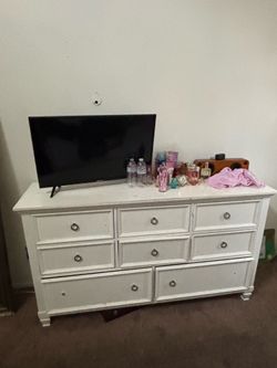 White dresser and white two night stands