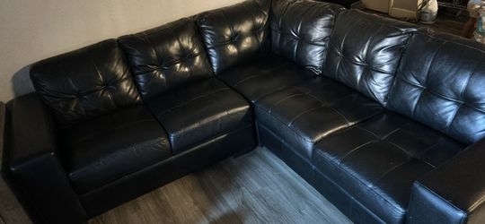 Black leather sectional sofa