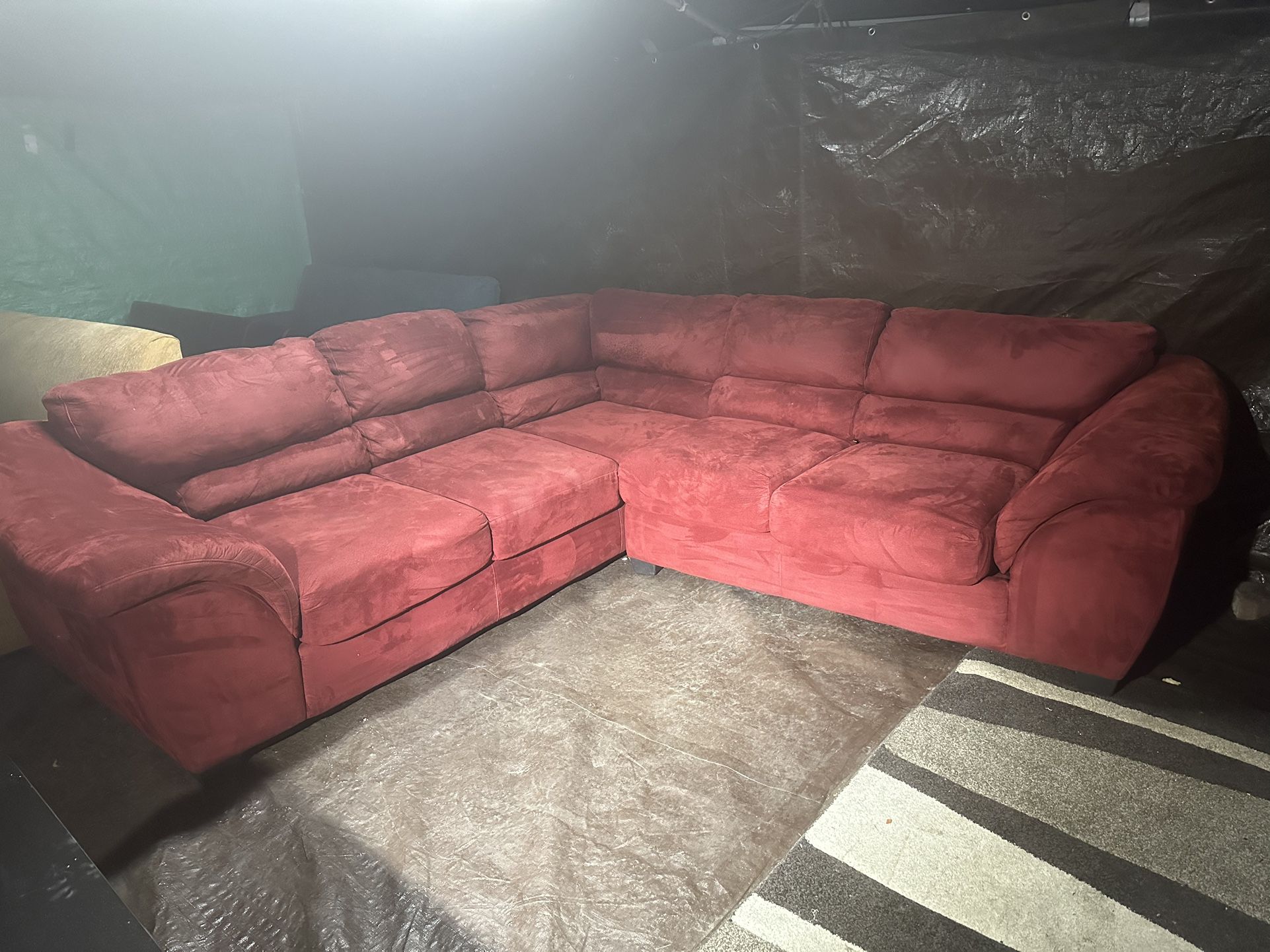 Red couch 200 we deliver for a fee