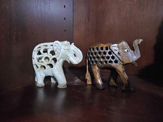 Set of two intricately carved elephant figurines