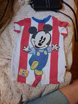 This outfit has 2 patches, Mickey and a square one on the bottom. This would make a great craft project,  this has 2 tiny holes, perfect for project