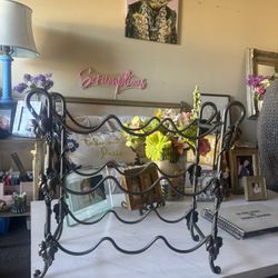 Iron wine rack with grape leaves