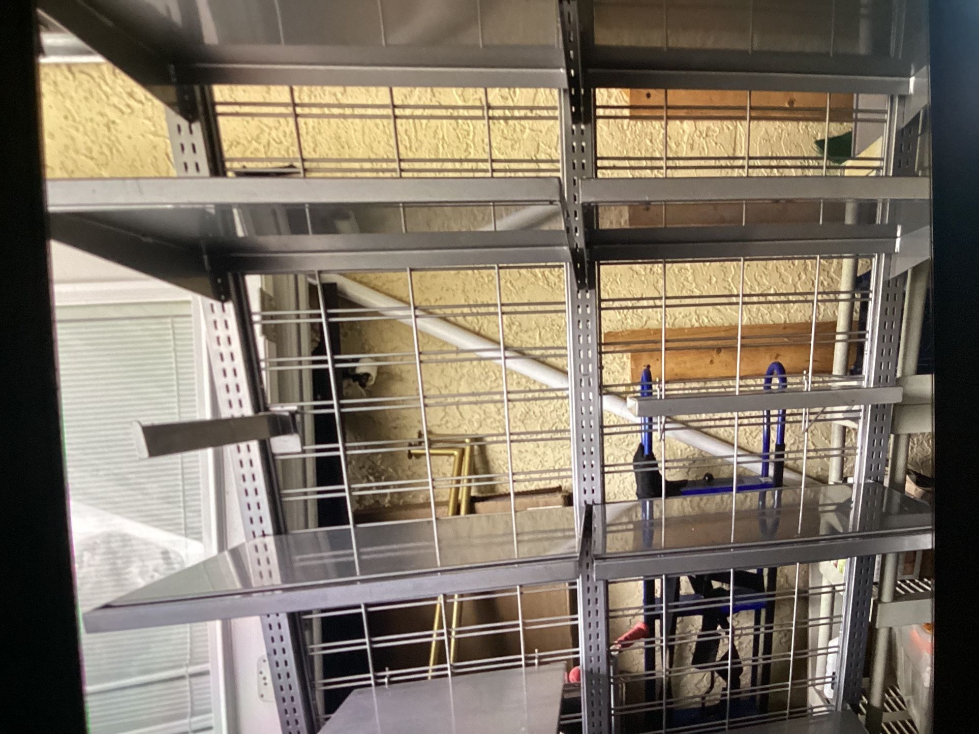 2 Sided Shelves Metal Rack “like New” Asking $150. Obo