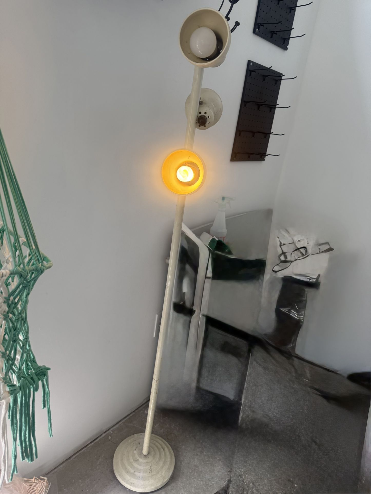 mid-century Danish-style floor lamp with multiple adjustable shades.