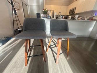 Pair of Grey Upholstered Swivel Bar Stools with Wood Legs