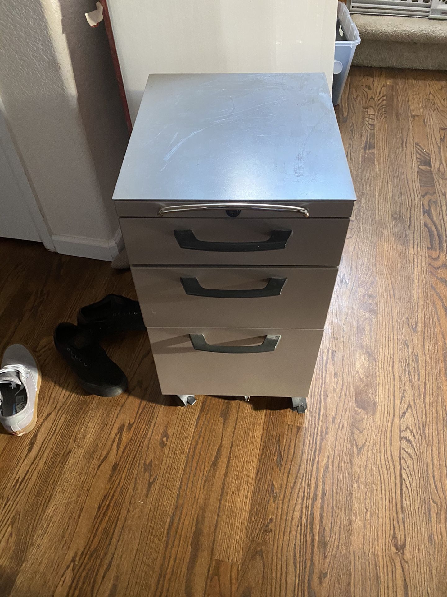 File Cabinet! Old School, actually built very well and has wheels.on base, locks with key