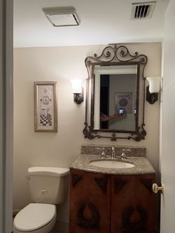 Mirror and light sconces