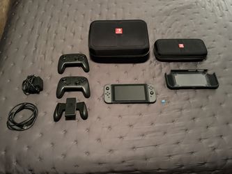 Nintendo Switch Bundle – 2 Pro Controllers, 256GB SD Card, Dock & Cases