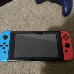 nintendo with a case controller dock and a traveling cash