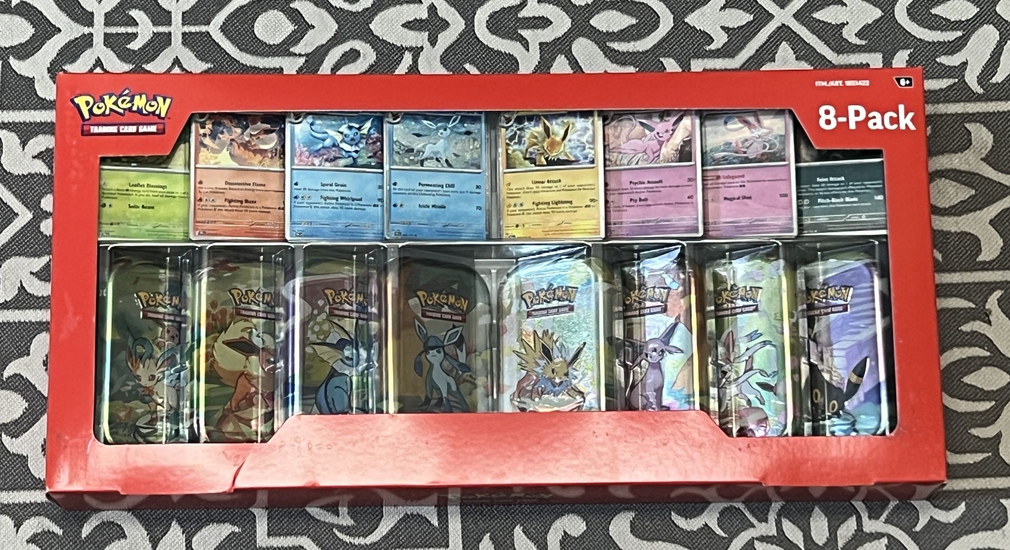 Prismatic Evolutions - 8 Pack Tin Bundle