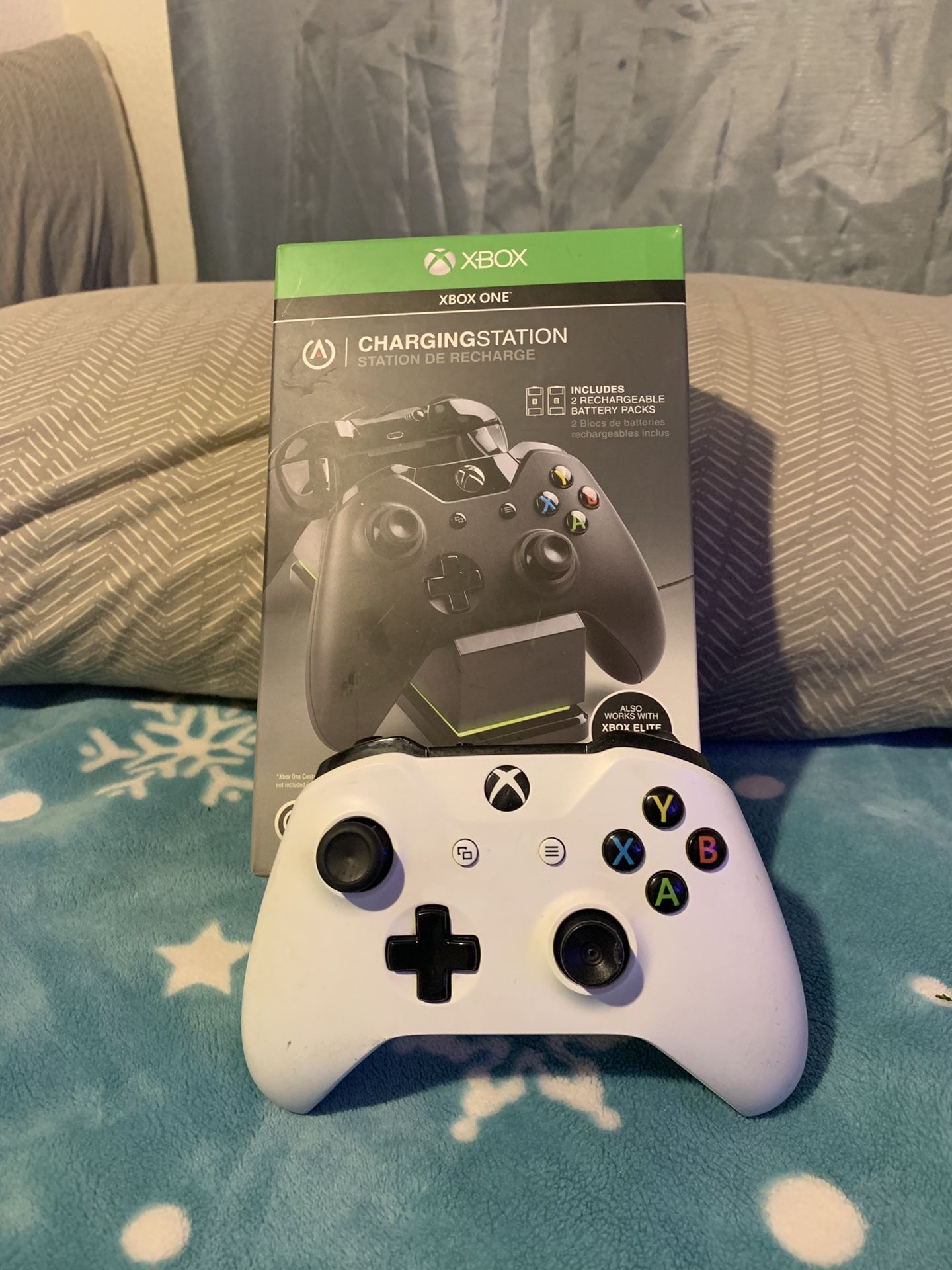 Xbox 1 controller with a double charger stations with everything included.