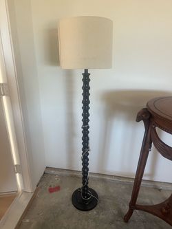 Black spindle floor lamp, cream shade — $45 OBO