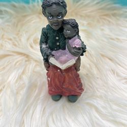 collectible figurine from the "All God's Children" collection designed by artist Martha Holcombe