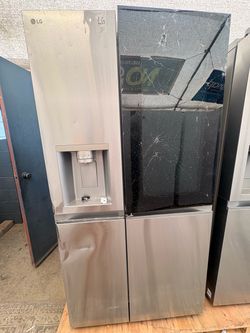 LG side by side refrigerator sold as is