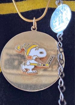 Authentic Charles Schultz gold Snoopy pendant