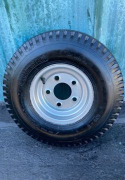 One tire 5.70-8 with rim