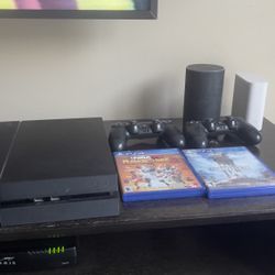Playstation 4 with two controllers and two games