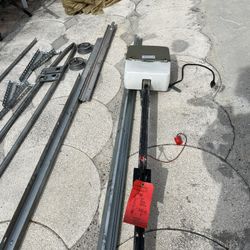Double garage motor working with all its parts and its 2 remote controls for opening and closing