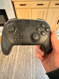 Nintendo Switch Pro Controller Black + two additional off brand Switch Controllers