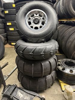 15” KMC Impact 4/137 for canam with 33” Sand Slingers 