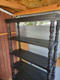 Amazing black wood shelf/bookcase. Ashley furniture