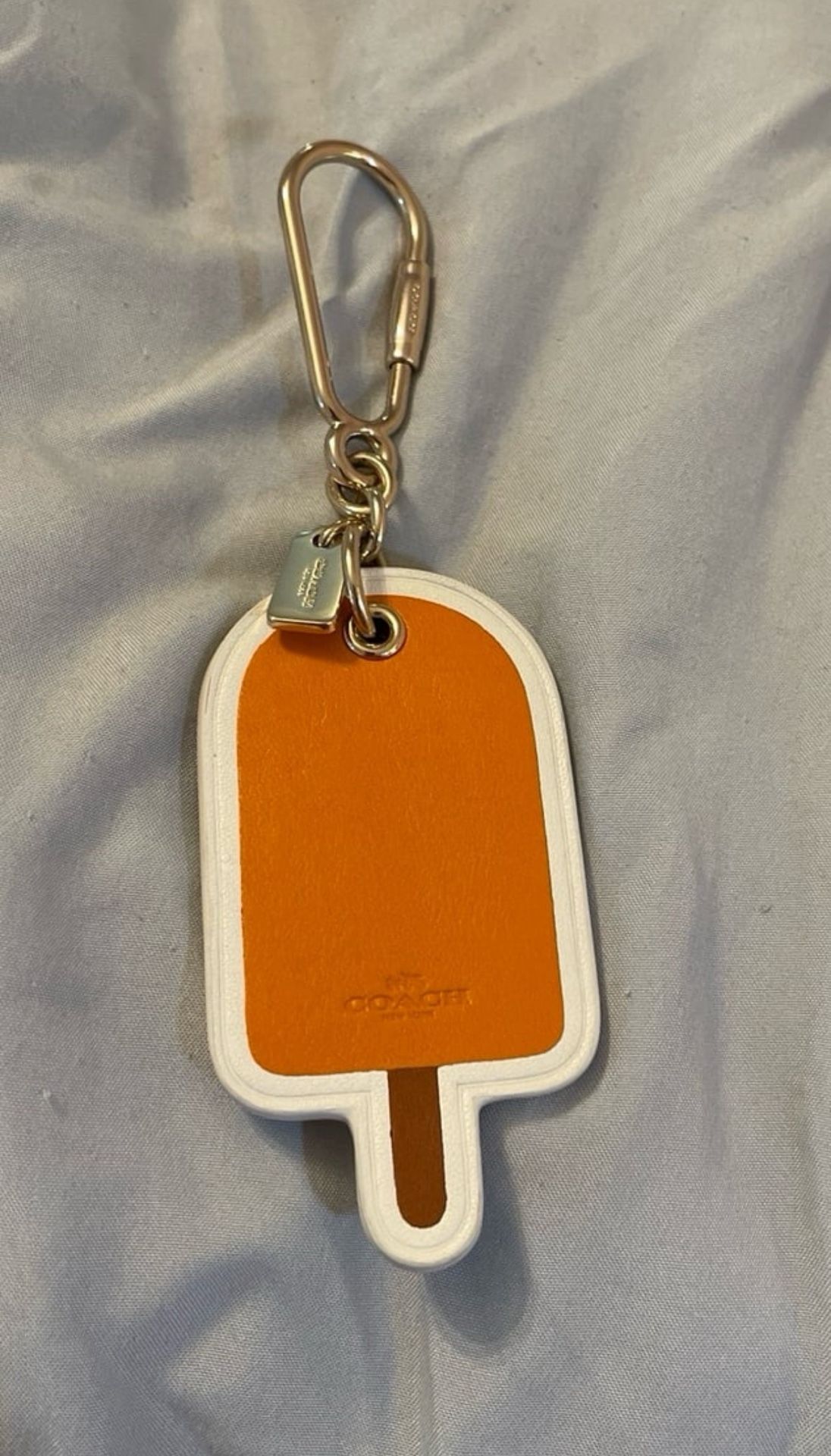 POPSICLE BAG CHARM BY COACH LIGHT GOLD/ORANGE
