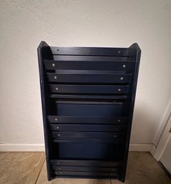 Navy blue pottery barn magazine shelf