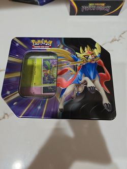 Opened tin with 400 Pokémon cards