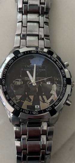 Beatles Abbey Road watch. A statement watch - very stylish. Keeps perfect time. Still like new. Perfect condition.