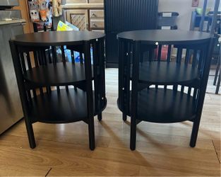Two black side tables