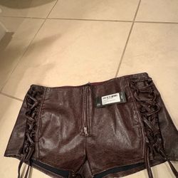 PrettyLittleThing brown faux leather lace-up shorts 