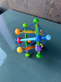 Never used. Manhattan Toy Skwish Wooden Rattle and Teether