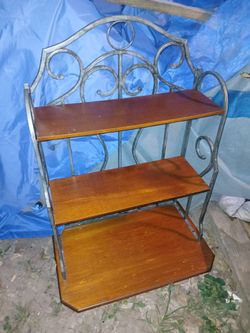 Solid Wooden Shelf With 3 shelves the sides are wrought Iron
